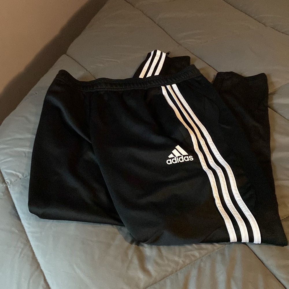 Men’s size Medium Adidas training pants back with white stripes.